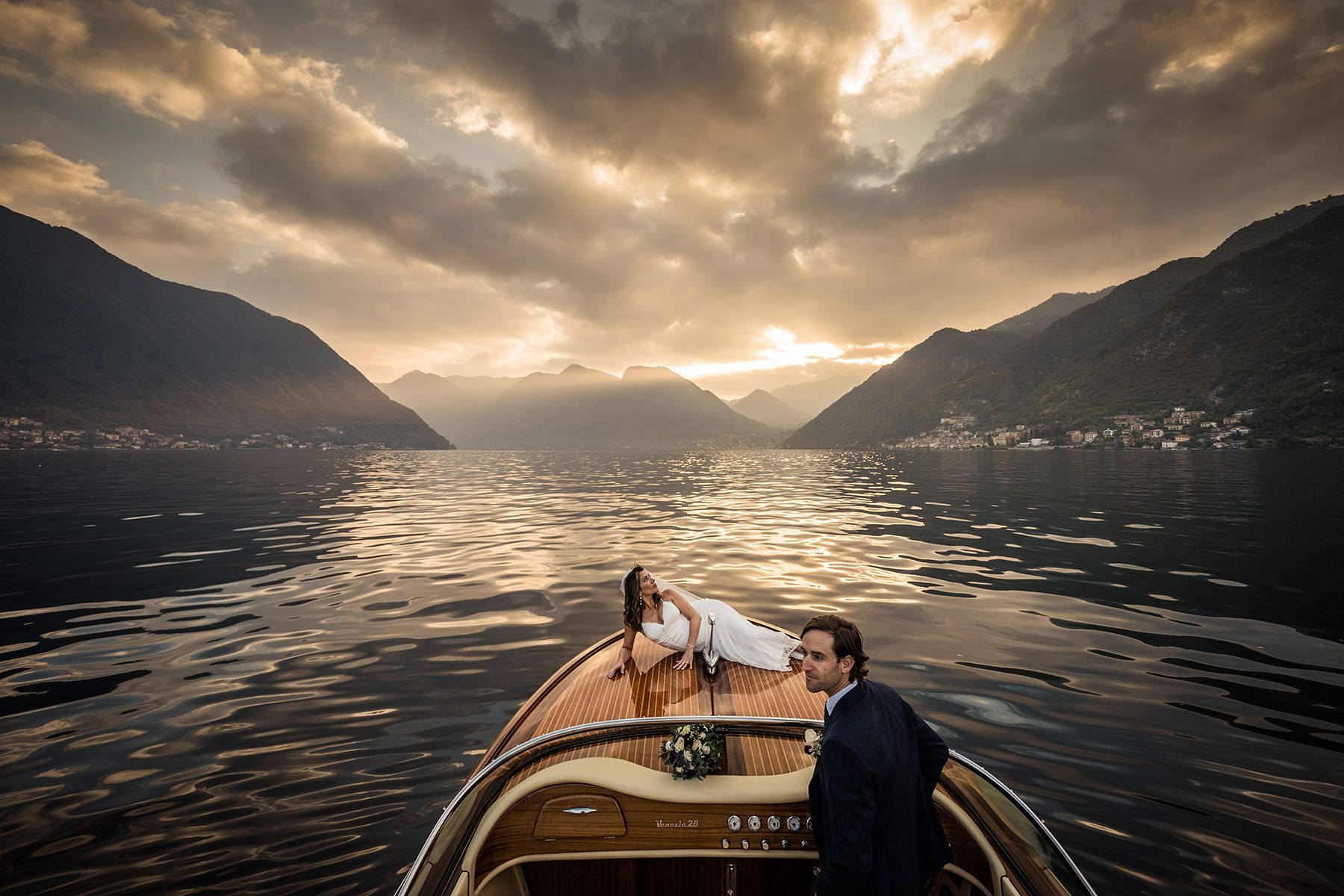 Elopement in Italy on a gondola in Venice with sunset backdrop